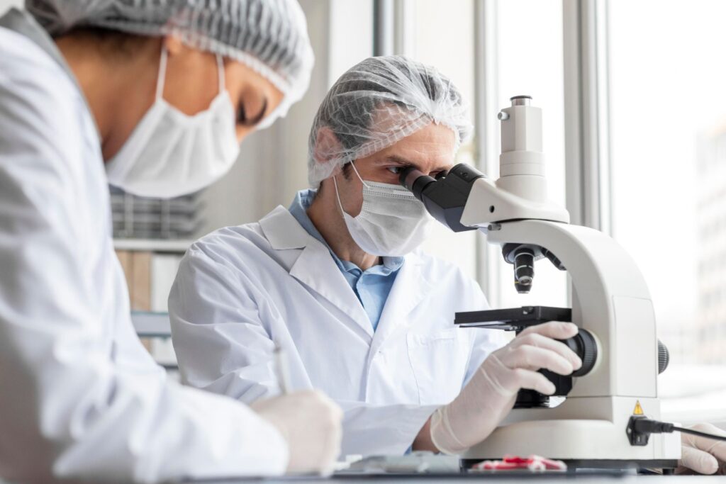 Scientist with microscope